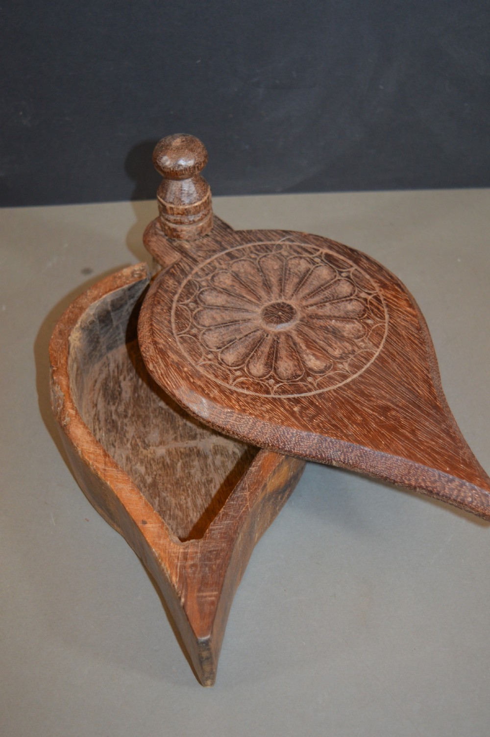 Pair of 19th-century Indian hand-carved teardrop-shaped hardwood spice boxes featuring intricate floral rosette motifs and a turned wood knob. View III