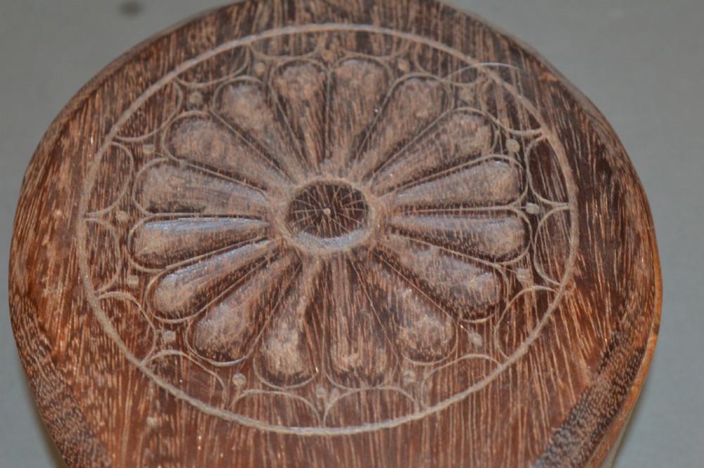 Pair of 19th-century Indian hand-carved teardrop-shaped hardwood spice boxes featuring intricate floral rosette motifs and a turned wood knob. View IV
