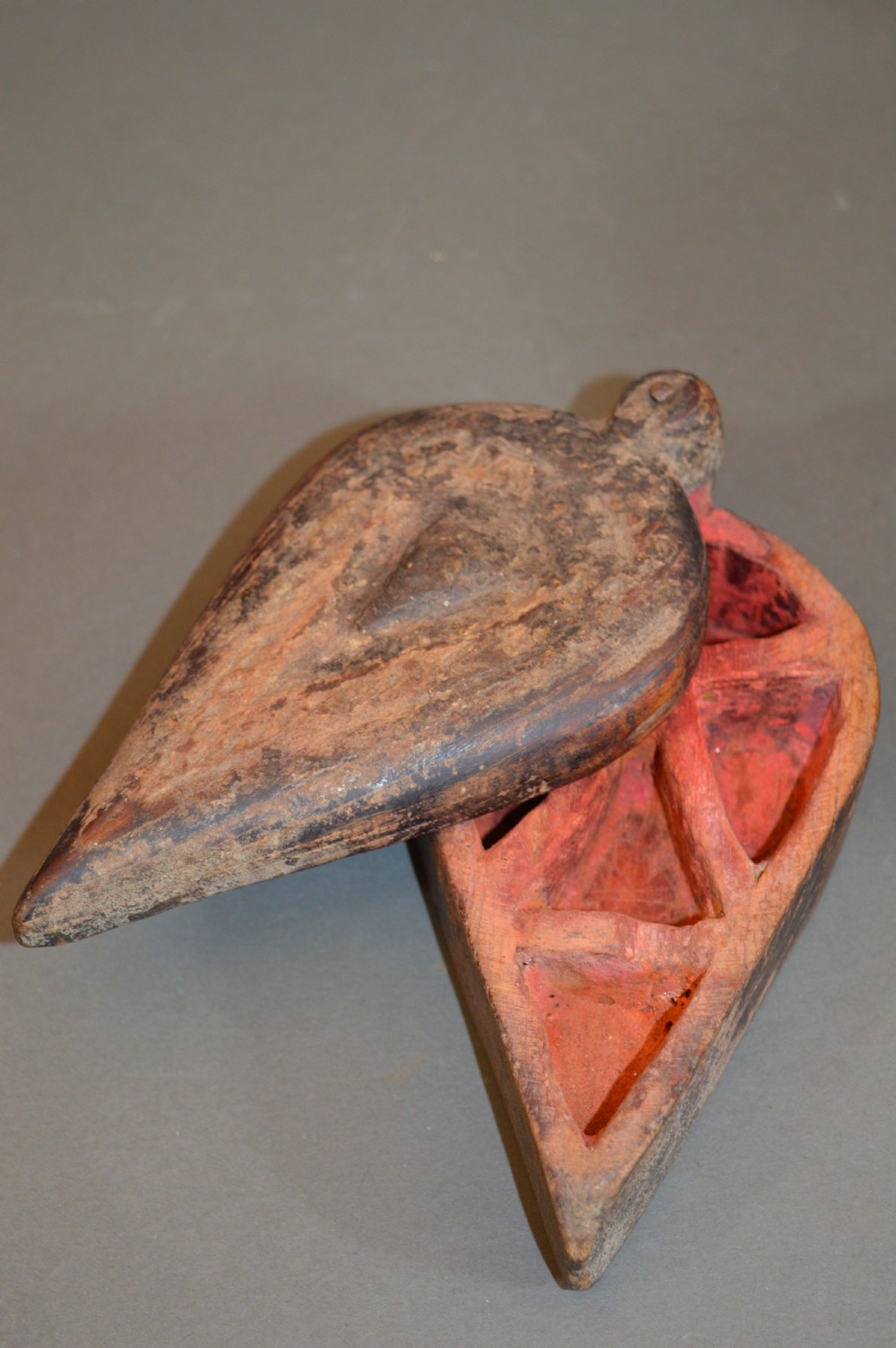 Pair of 19th-century Indian hand-carved teardrop-shaped hardwood spice boxes featuring intricate floral rosette motifs and a turned wood knob. View V