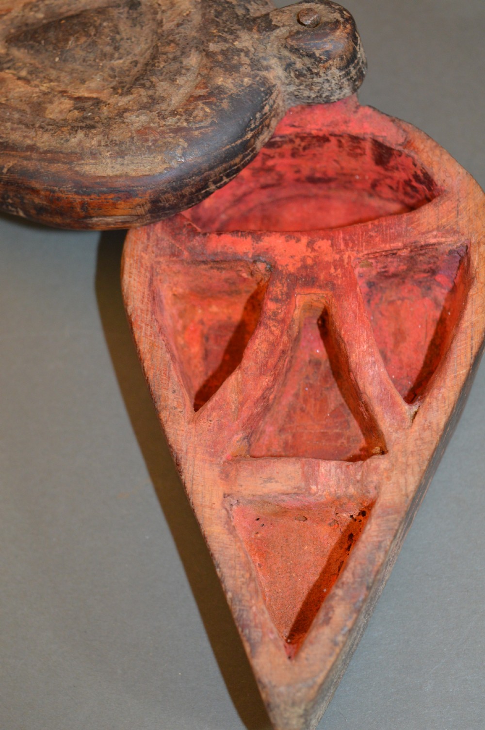 Pair of 19th-century Indian hand-carved teardrop-shaped hardwood spice boxes featuring intricate floral rosette motifs and a turned wood knob. View VI