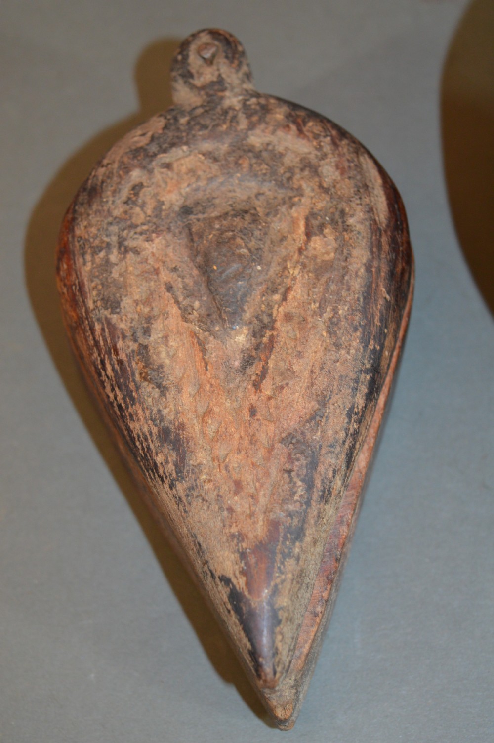 Pair of 19th-century Indian hand-carved teardrop-shaped hardwood spice boxes featuring intricate floral rosette motifs and a turned wood knob. View VII