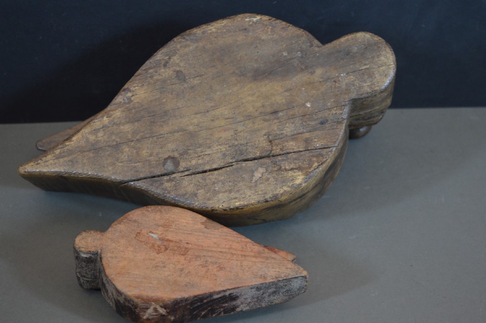 Pair of 19th-century Indian hand-carved teardrop-shaped hardwood spice boxes featuring intricate floral rosette motifs and a turned wood knob. View IX