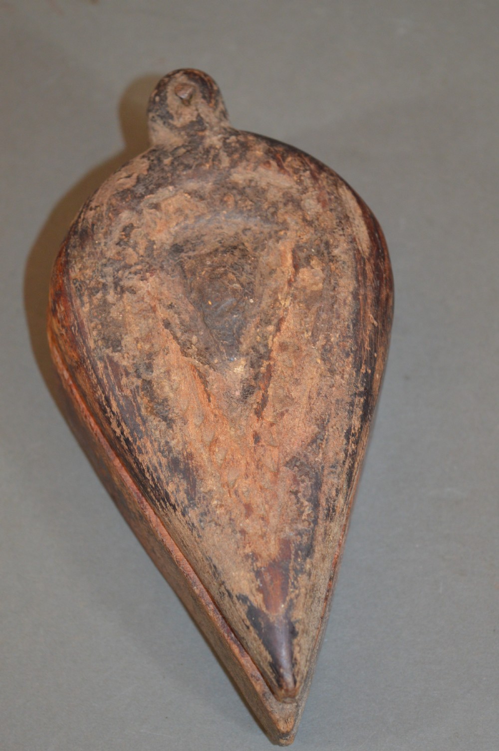 Pair of 19th-century Indian hand-carved teardrop-shaped hardwood spice boxes featuring intricate floral rosette motifs and a turned wood knob. View X