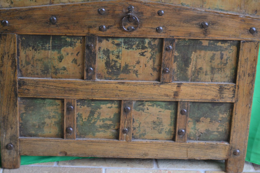 An arched antique Chinese wooden cart door featuring faded hand-painted figures, weathered green pigments, and iron studs. View XI
