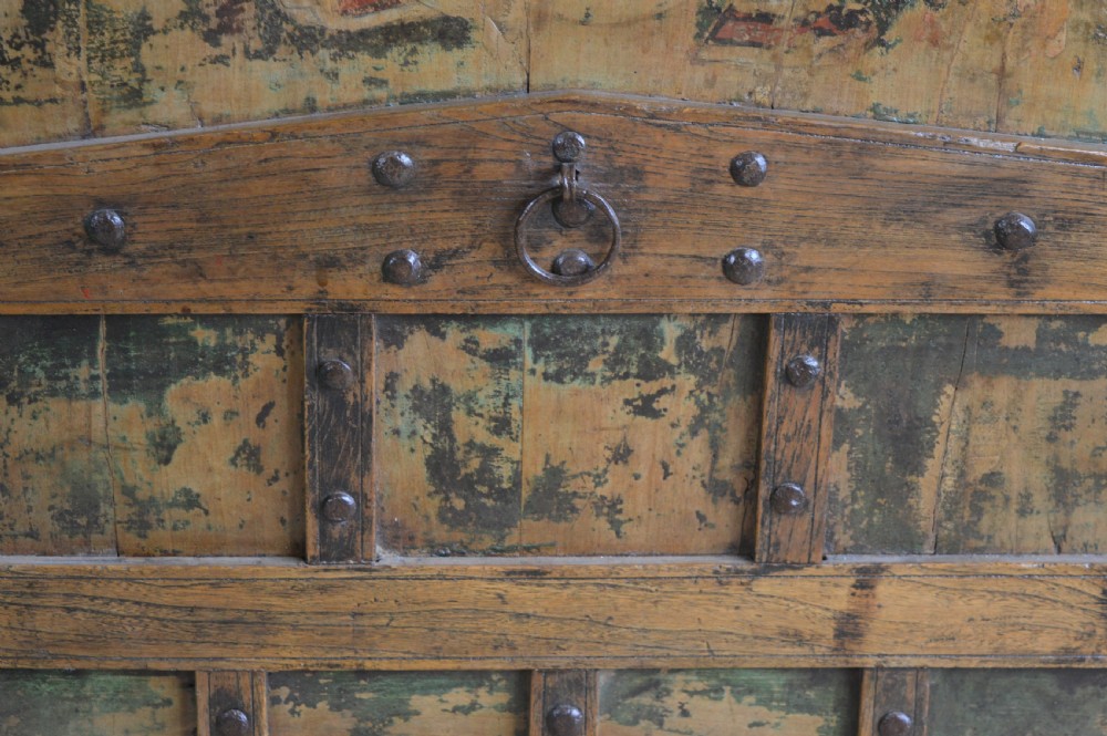 An arched antique Chinese wooden cart door featuring faded hand-painted figures, weathered green pigments, and iron studs. View XII
