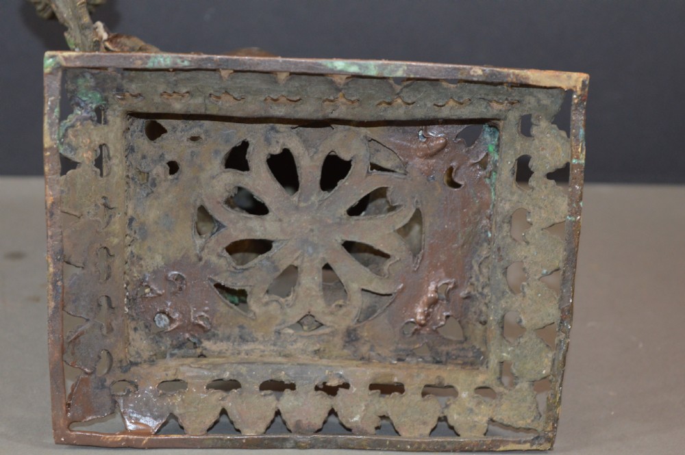 A late 18th-century Chinese bronze incense burner in the shape of a mythical Qilin creature with an open mouth standing on a pierced rectangular stand. View IX