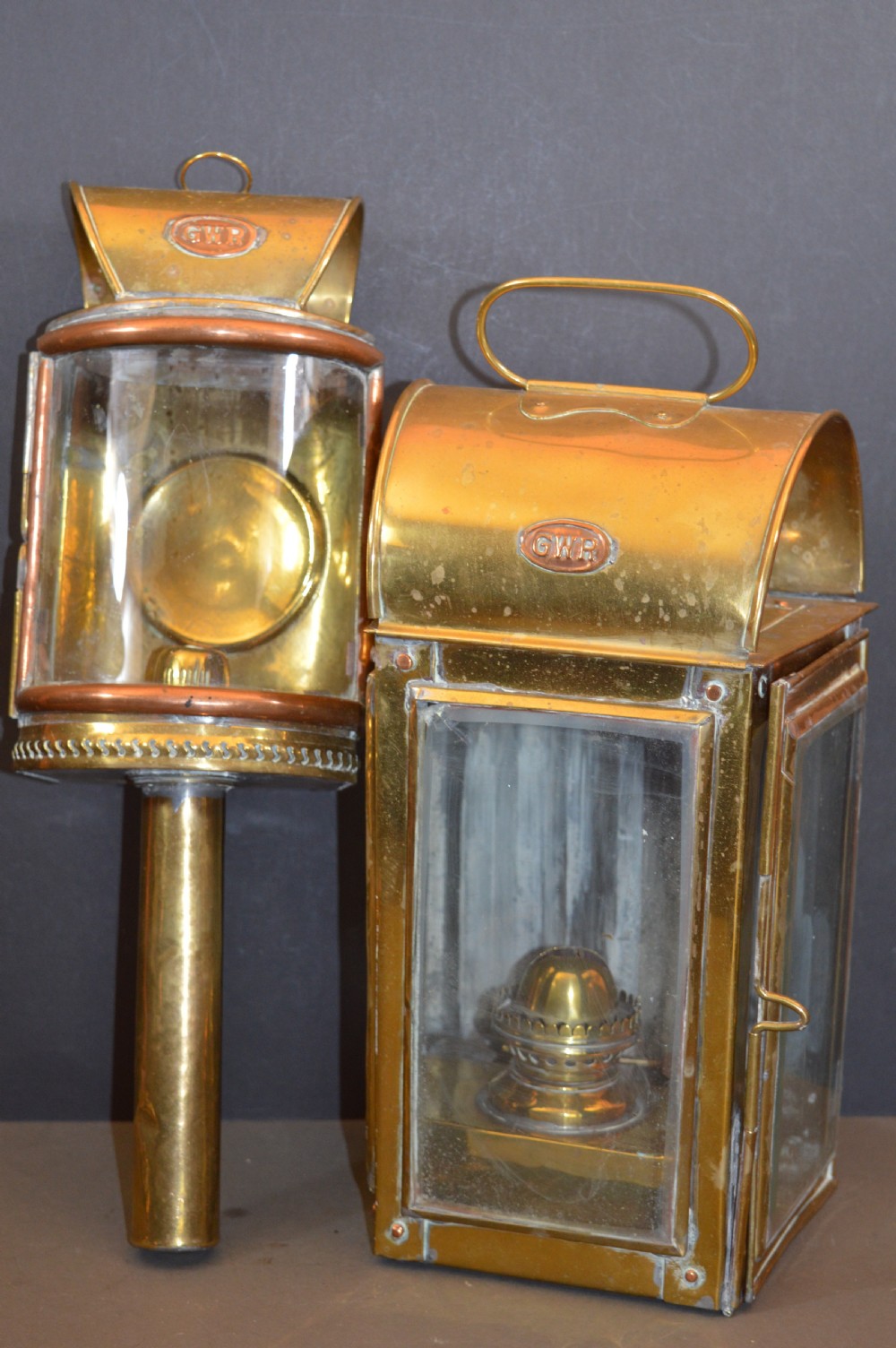 A pair of 19th-century GWR brass and copper railway carriage oil lamps featuring engraved oval GWR plaques. View II