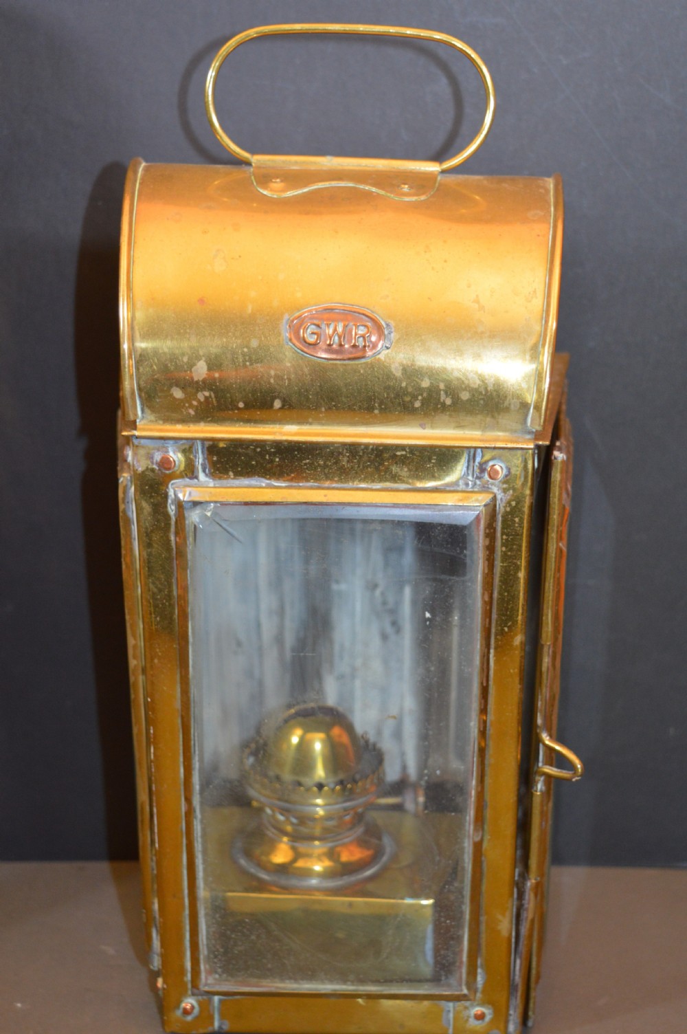 A pair of 19th-century GWR brass and copper railway carriage oil lamps featuring engraved oval GWR plaques. View IV