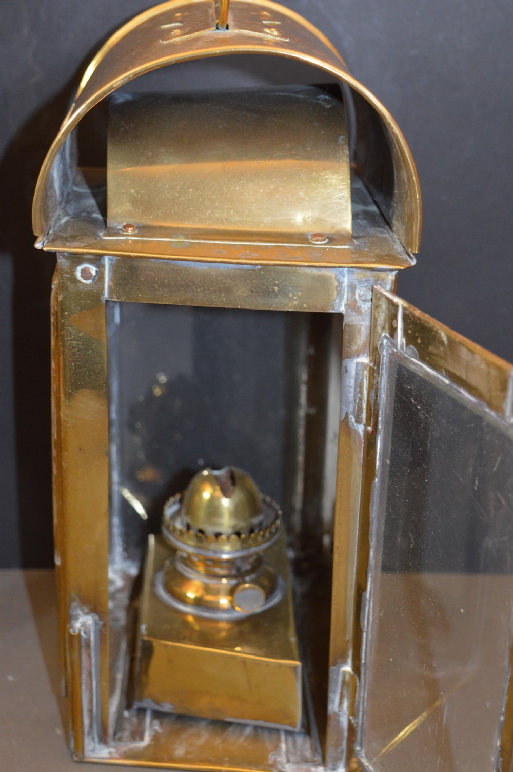 A pair of 19th-century GWR brass and copper railway carriage oil lamps featuring engraved oval GWR plaques. View VI