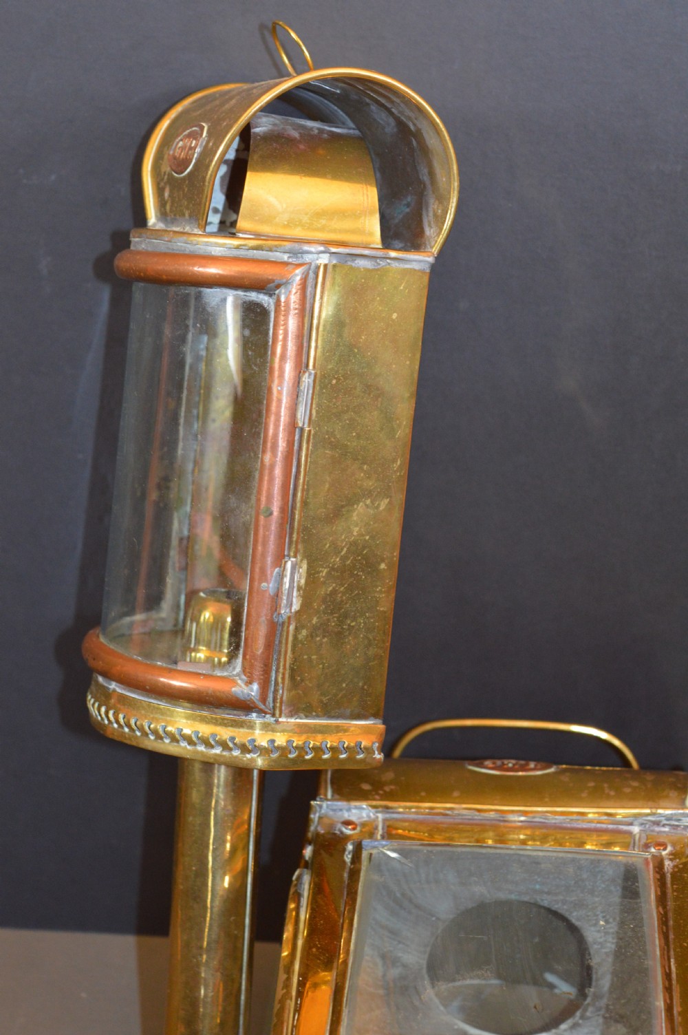 A pair of 19th-century GWR brass and copper railway carriage oil lamps featuring engraved oval GWR plaques. View IX