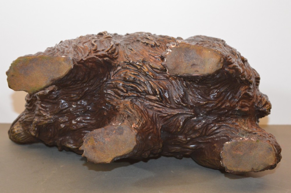 A heavy cast bronze sculpture depicting a bear with textured fur and an open mouth in a walking pose. View VIII