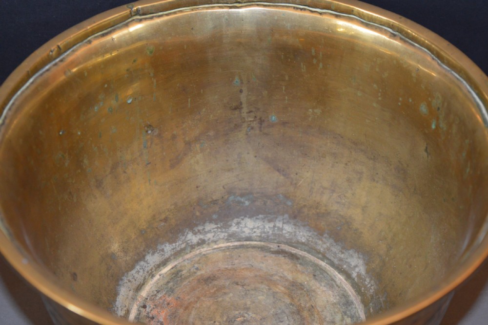 A heavy polished brass Japanese jardiniere with incised dragon artwork and geometric key fret borders around the exterior. View III