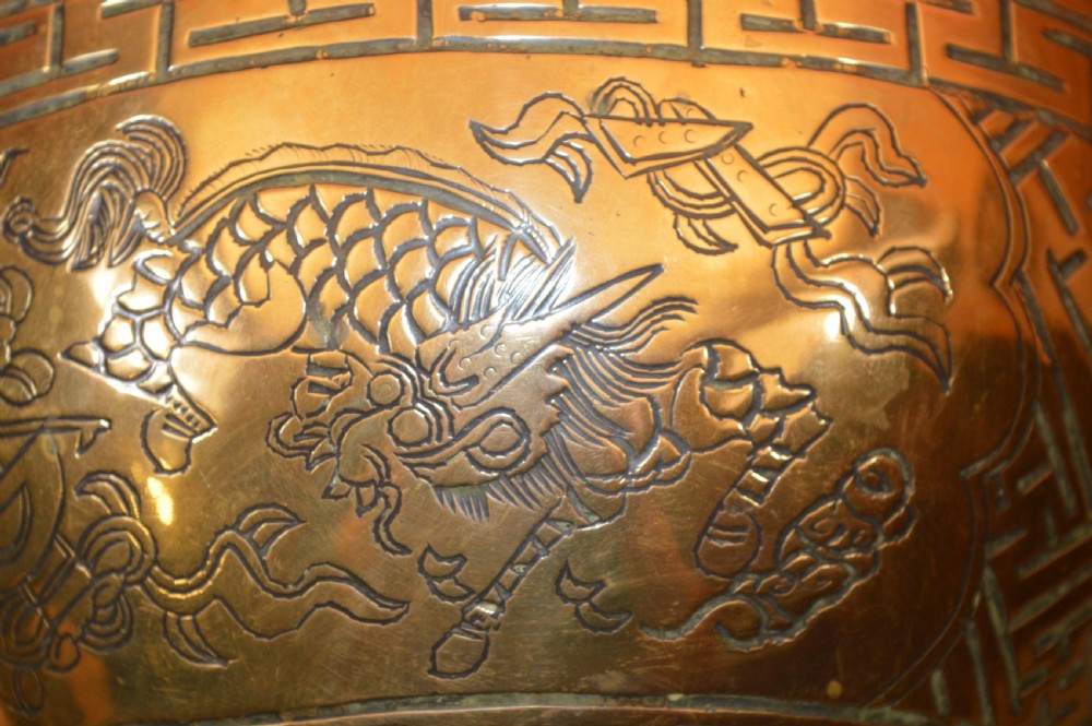 A heavy polished brass Japanese jardiniere with incised dragon artwork and geometric key fret borders around the exterior. View IV