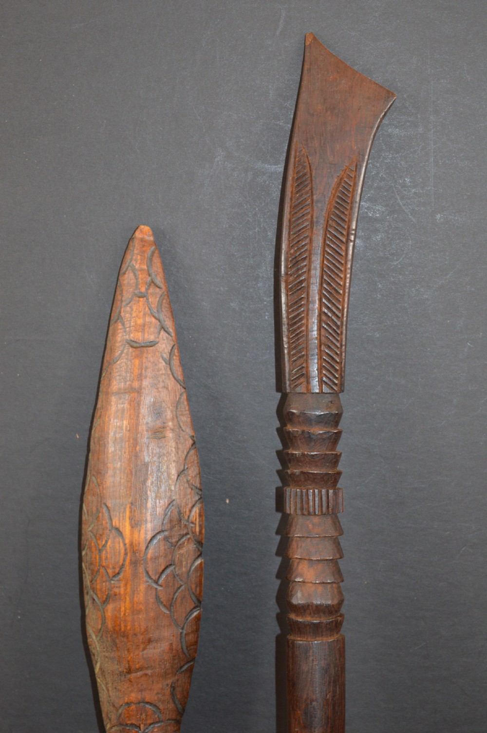 Pair of late nineteenth-century hand-carved dark hardwood Oceanic war clubs featuring geometric carved decoration on the heads. View II