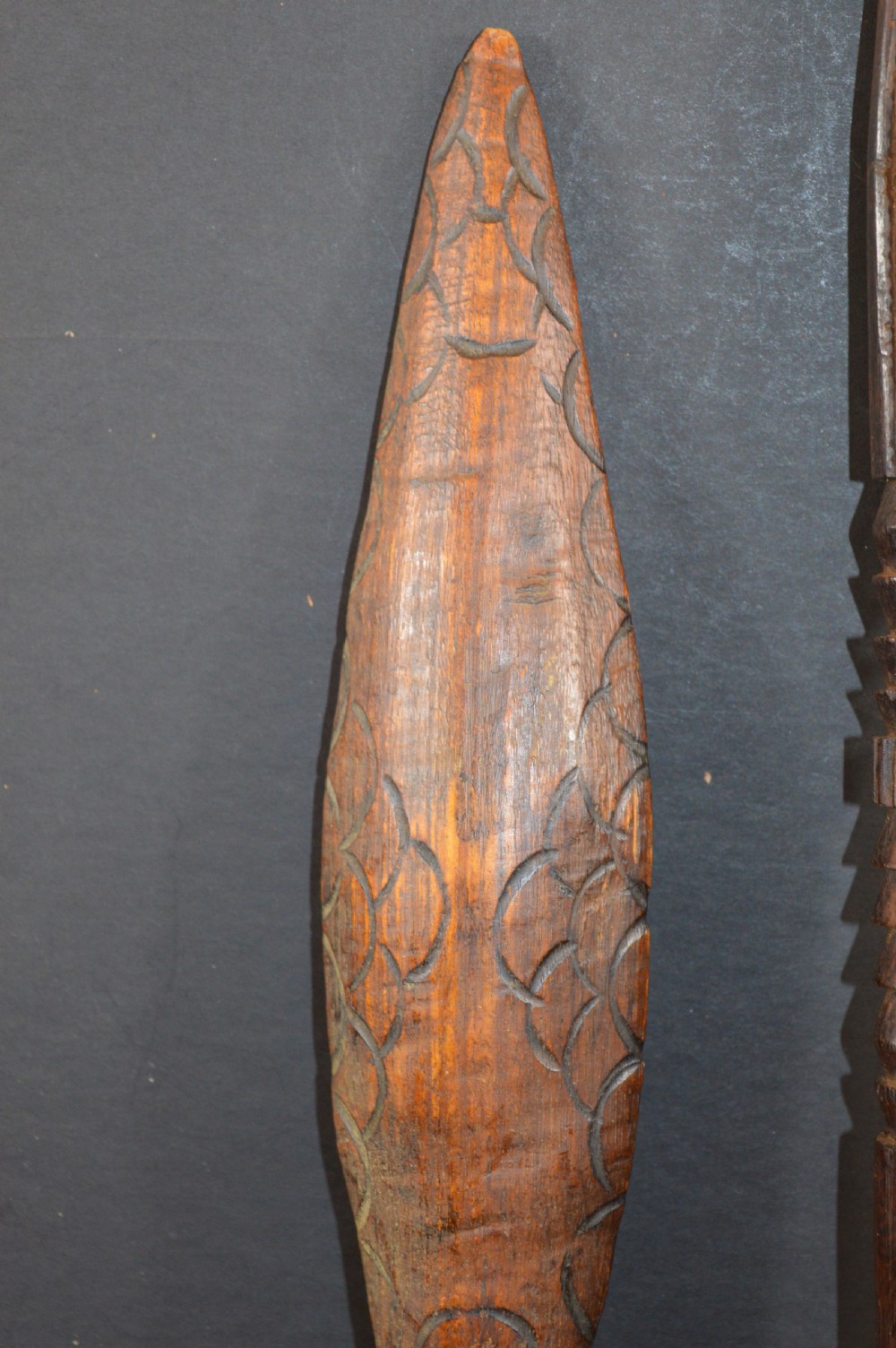 Pair of late nineteenth-century hand-carved dark hardwood Oceanic war clubs featuring geometric carved decoration on the heads. View III