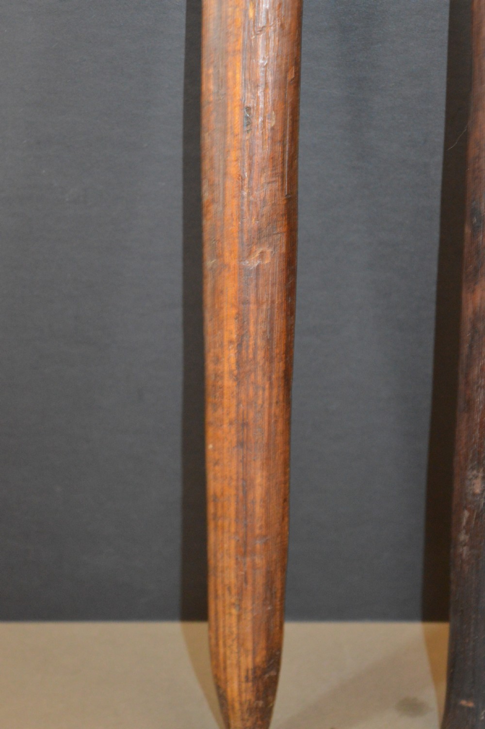 Pair of late nineteenth-century hand-carved dark hardwood Oceanic war clubs featuring geometric carved decoration on the heads. View V