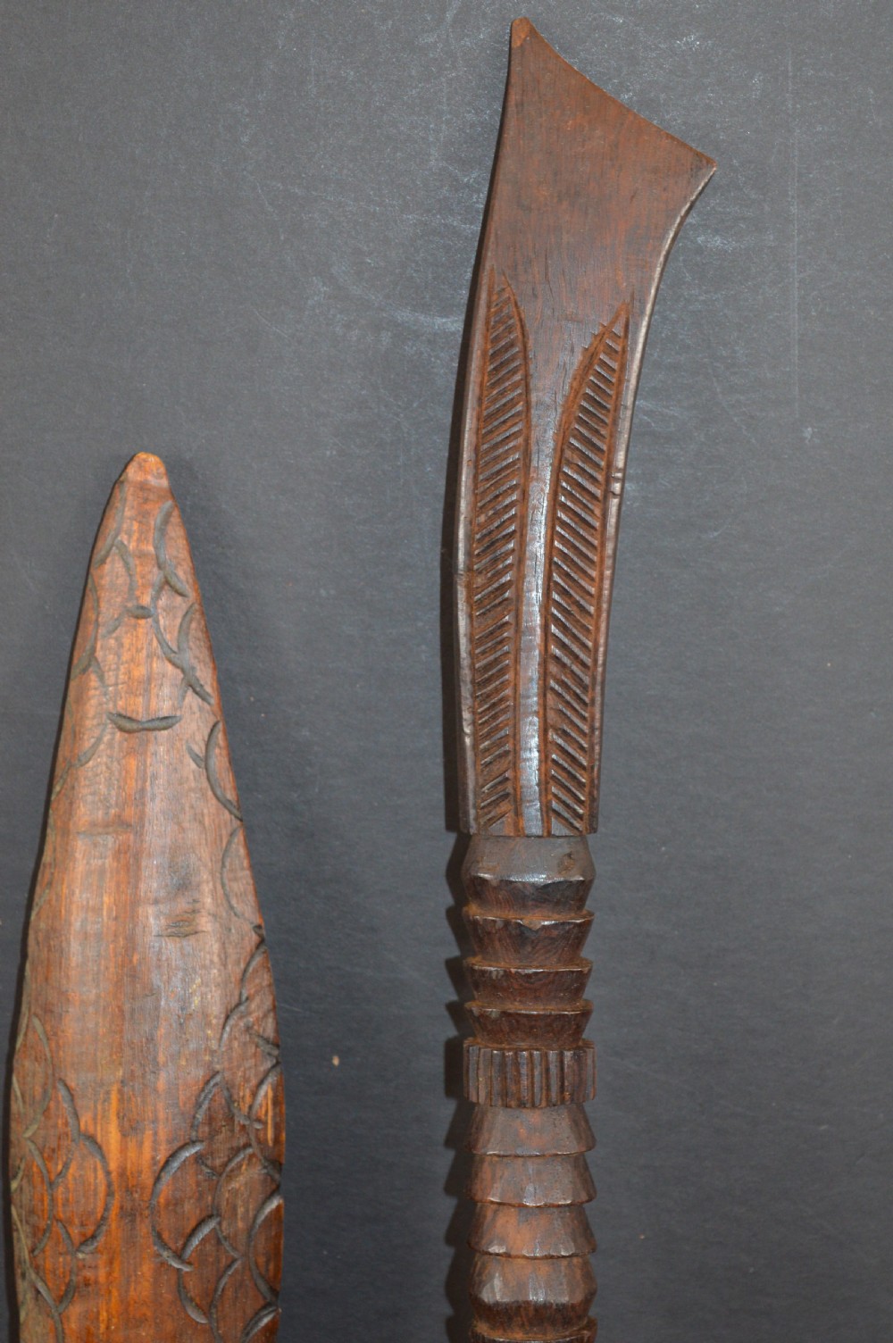 Pair of late nineteenth-century hand-carved dark hardwood Oceanic war clubs featuring geometric carved decoration on the heads. View VII