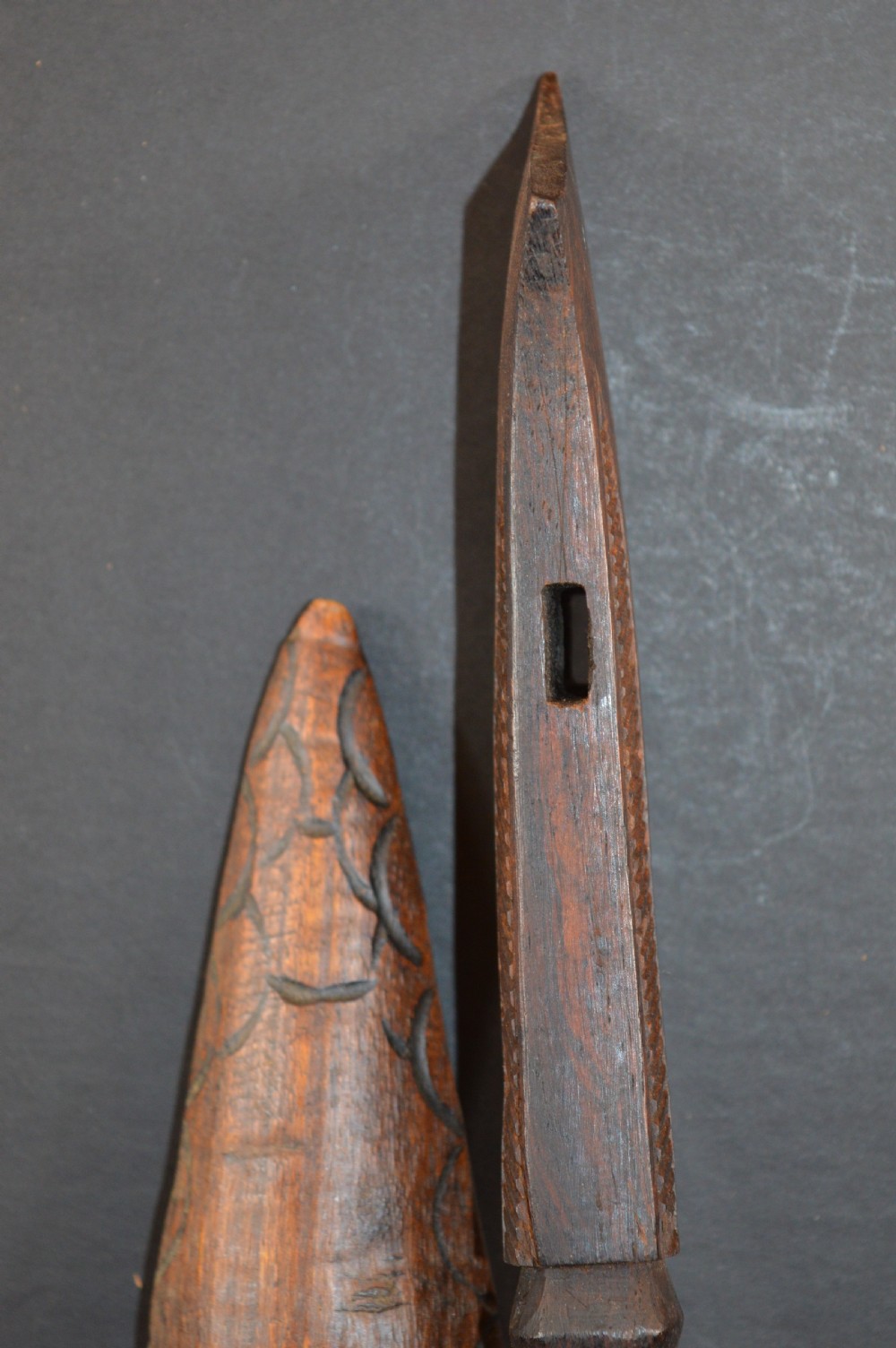 Pair of late nineteenth-century hand-carved dark hardwood Oceanic war clubs featuring geometric carved decoration on the heads. View VIII