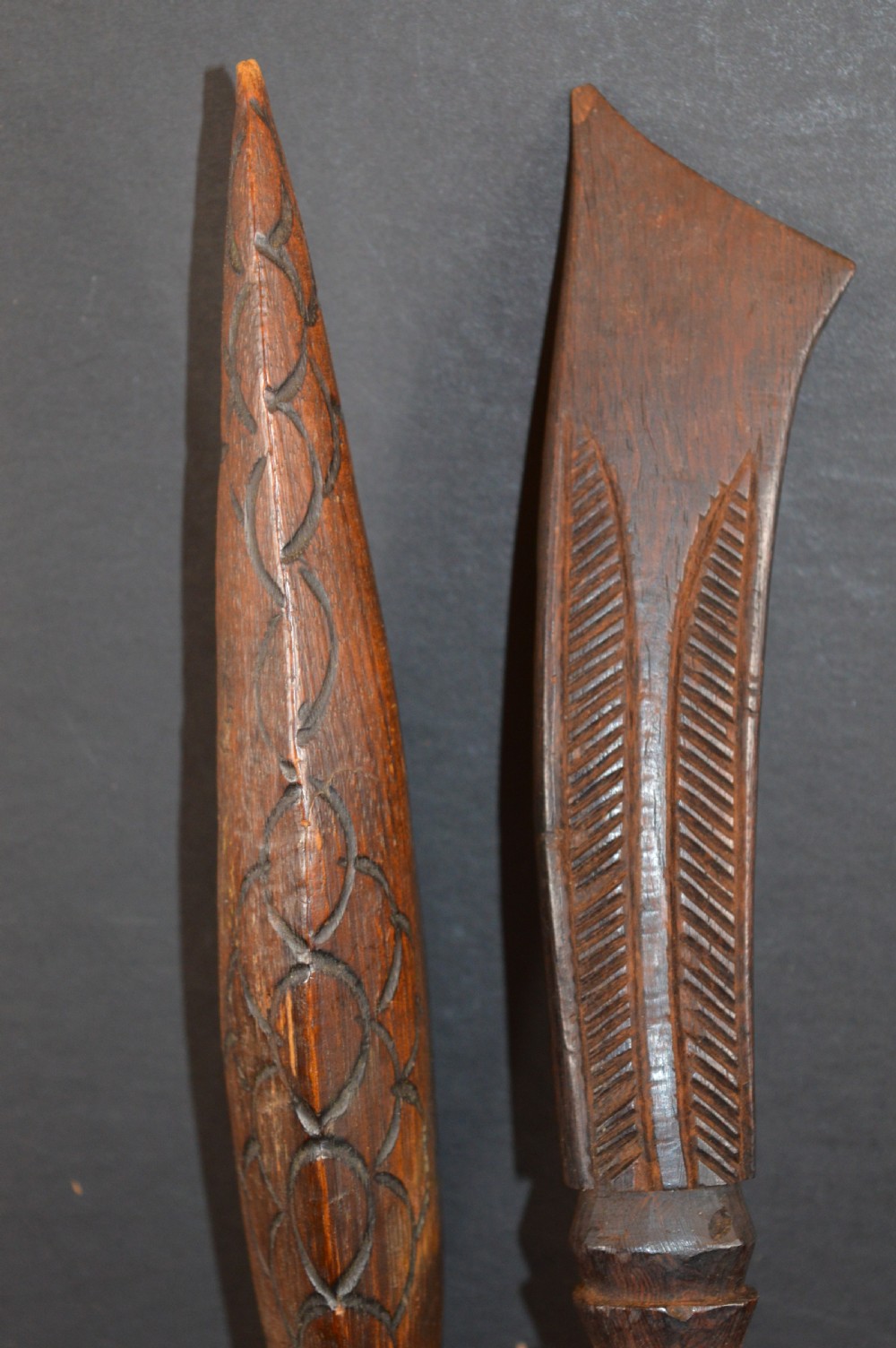 Pair of late nineteenth-century hand-carved dark hardwood Oceanic war clubs featuring geometric carved decoration on the heads. View IX