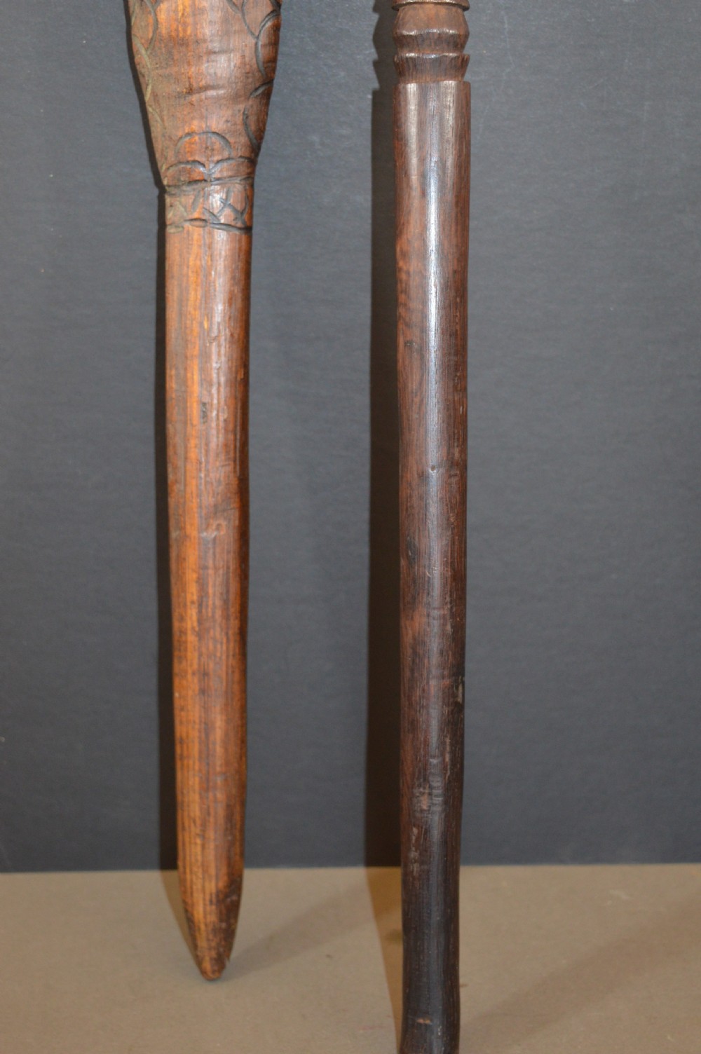 Pair of late nineteenth-century hand-carved dark hardwood Oceanic war clubs featuring geometric carved decoration on the heads. View XI