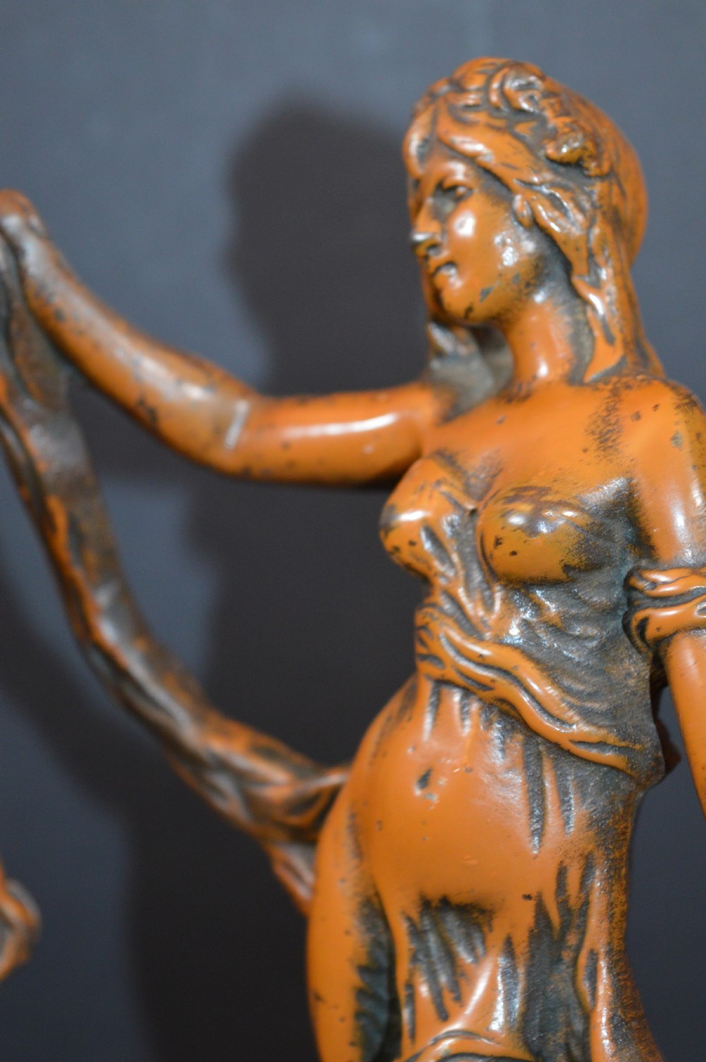 A pair of late nineteenth-century French bronzed metal allegorical female statues titled Modestie and Gaiete, mounted on circular turned wooden bases with brass nameplates. View X