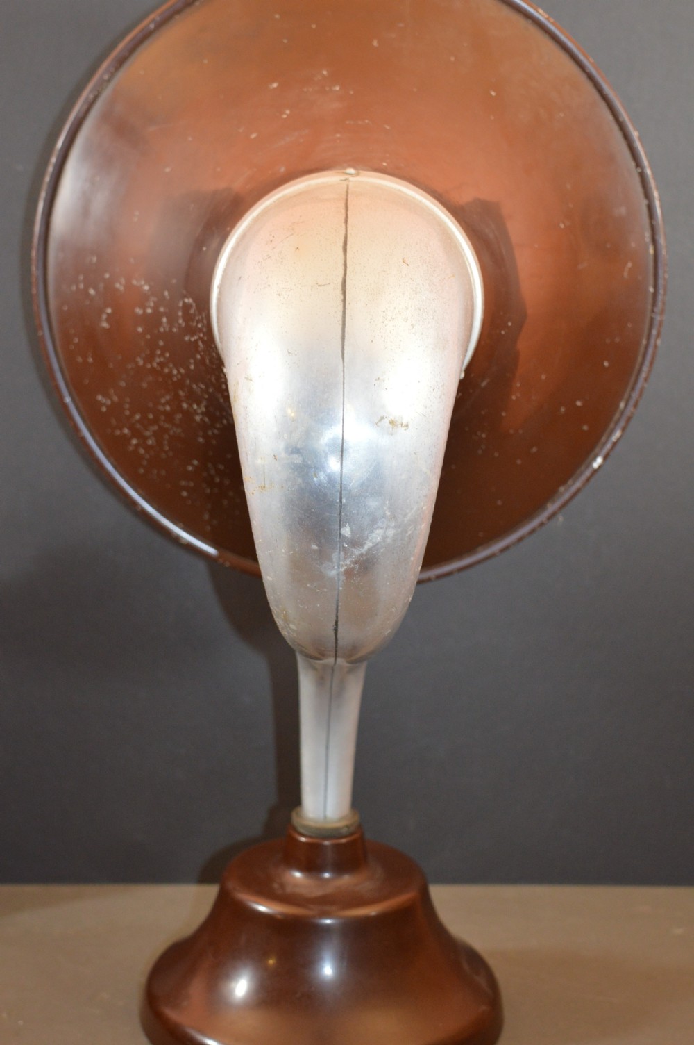 An antique 1930s British Thomson-Houston horn loudspeaker with a flared dark brown Bakelite bell, a curved silver metal neck, and a matching rounded Bakelite base. View VIII