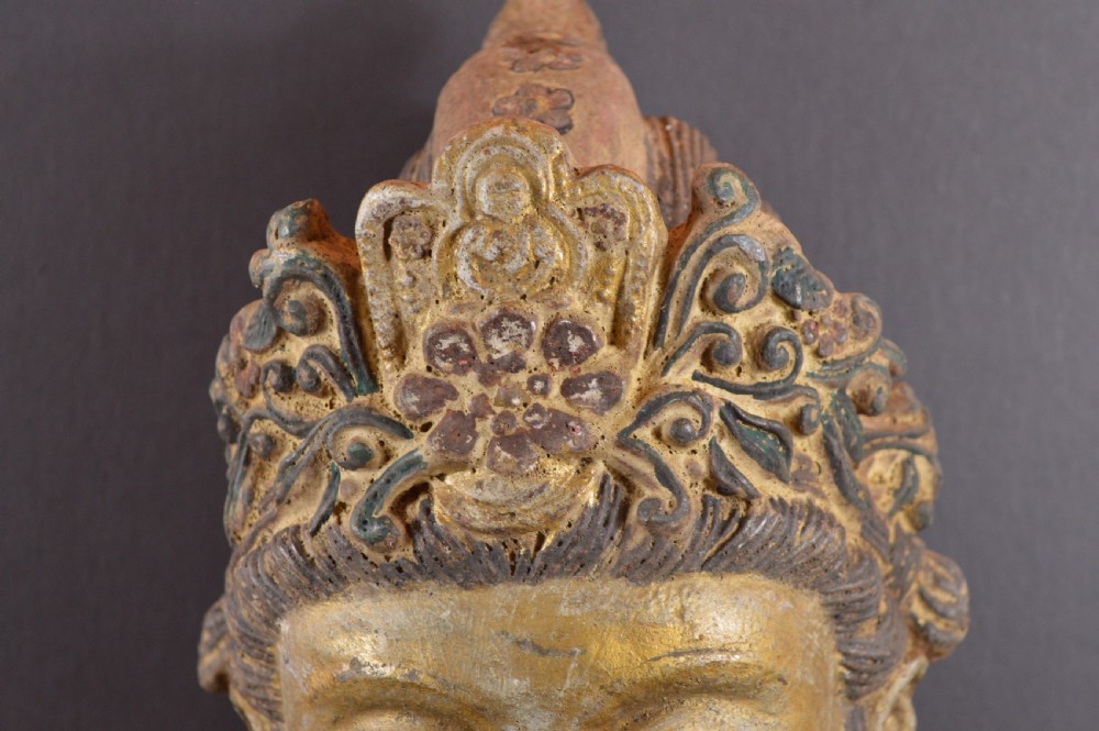 A late 19th-century cast iron head sculpture of Guanyin featuring detailed scrollwork tiara and residual gold gilding. View IV