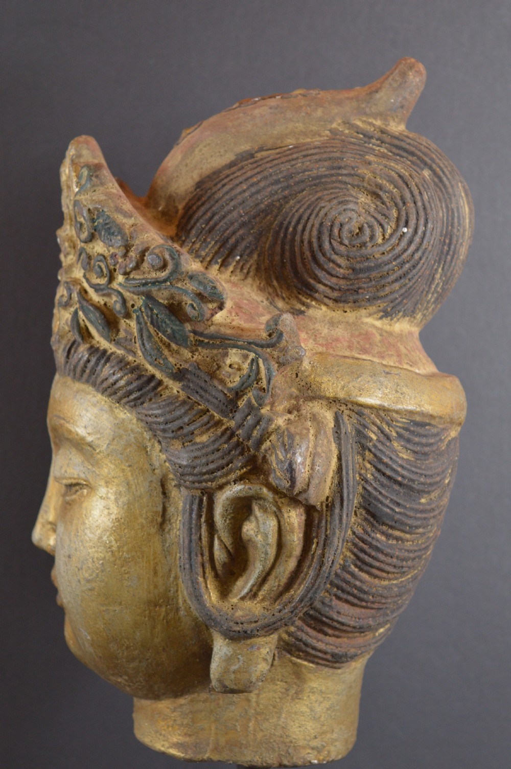 A late 19th-century cast iron head sculpture of Guanyin featuring detailed scrollwork tiara and residual gold gilding. View VII