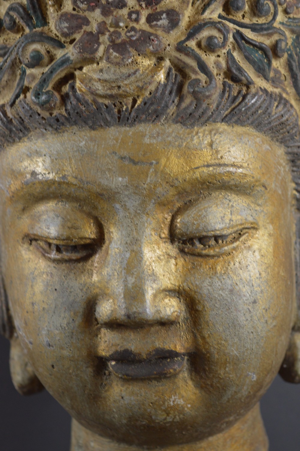 A late 19th-century cast iron head sculpture of Guanyin featuring detailed scrollwork tiara and residual gold gilding. View IX