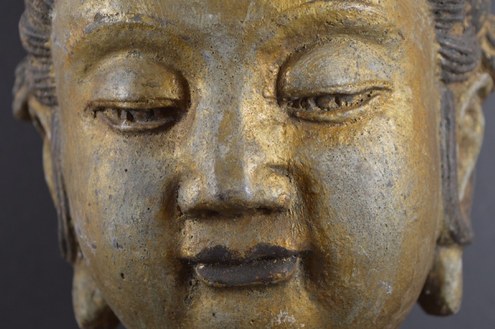 A late 19th-century cast iron head sculpture of Guanyin featuring detailed scrollwork tiara and residual gold gilding. View XI