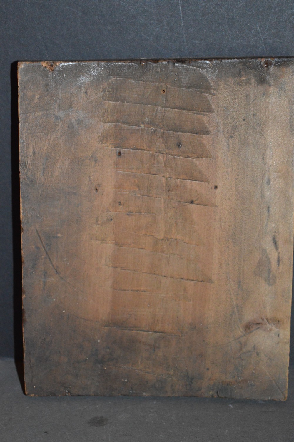 A rectangular wooden panel featuring three square brass Russian icons and a central relief of a winged angel head. View VI