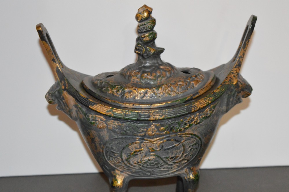 A late Qing dynasty dark parcel-gilt bronze censer featuring raised phoenix relief panels, extended vertical handles, and a serpent finial lid. View XIII