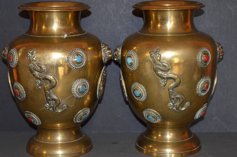 A matching pair of polished brass baluster vases featuring applied serpentine dragon motifs and circular beaded medallions set with turquoise and coral cabochons. View II