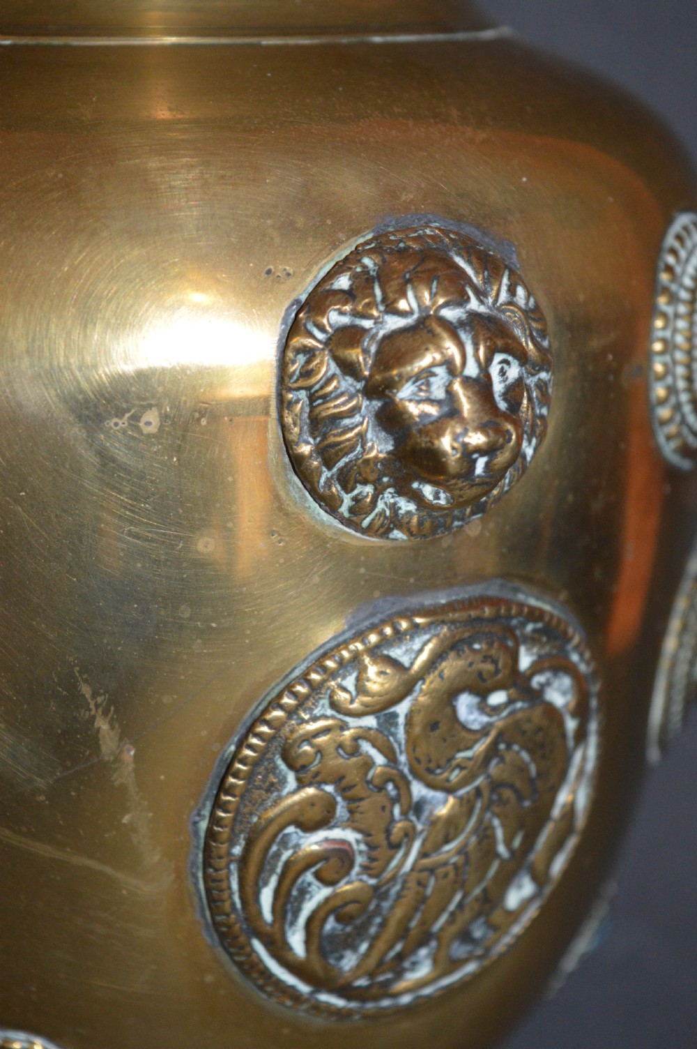 A matching pair of polished brass baluster vases featuring applied serpentine dragon motifs and circular beaded medallions set with turquoise and coral cabochons. View IV