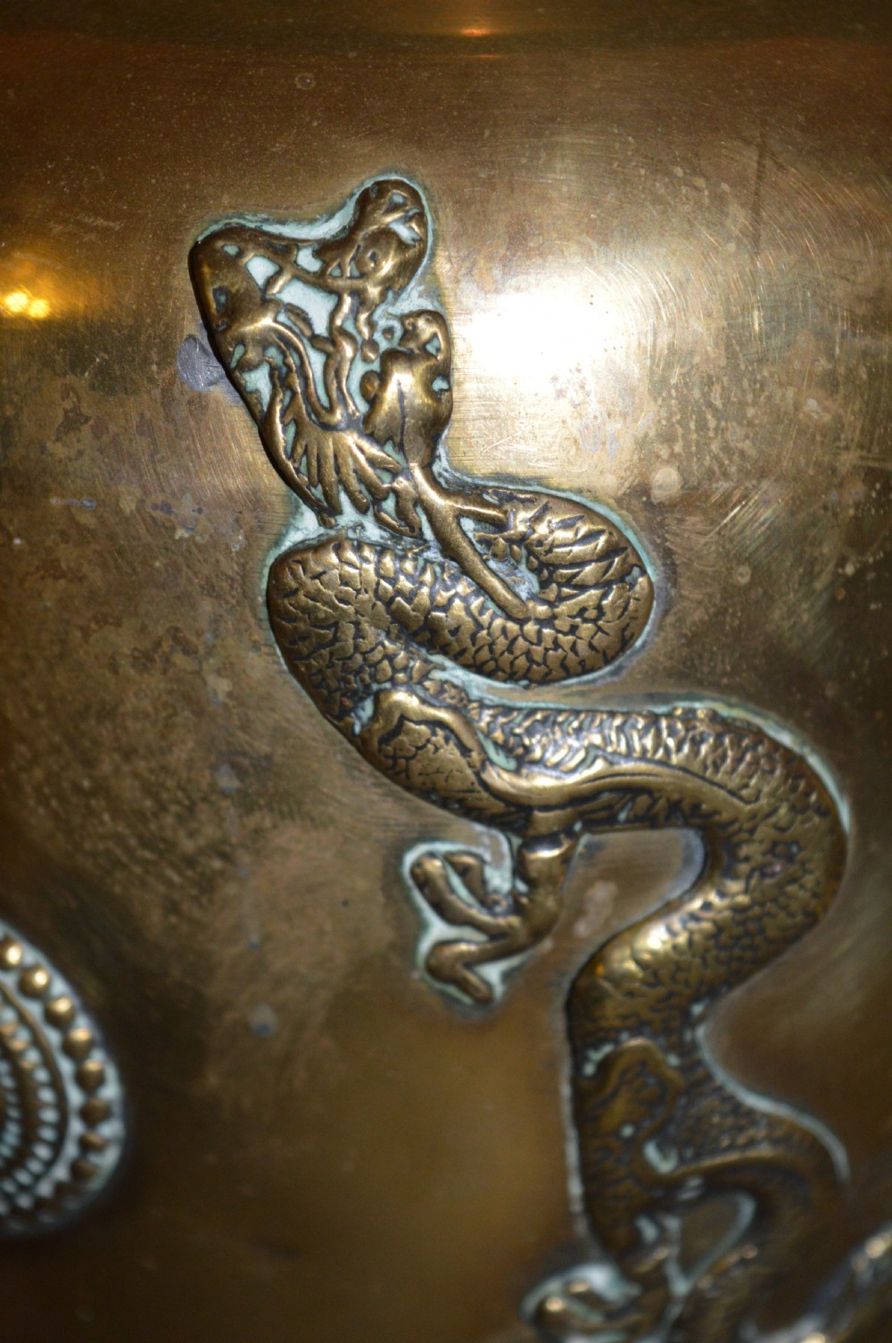 A matching pair of polished brass baluster vases featuring applied serpentine dragon motifs and circular beaded medallions set with turquoise and coral cabochons. View V