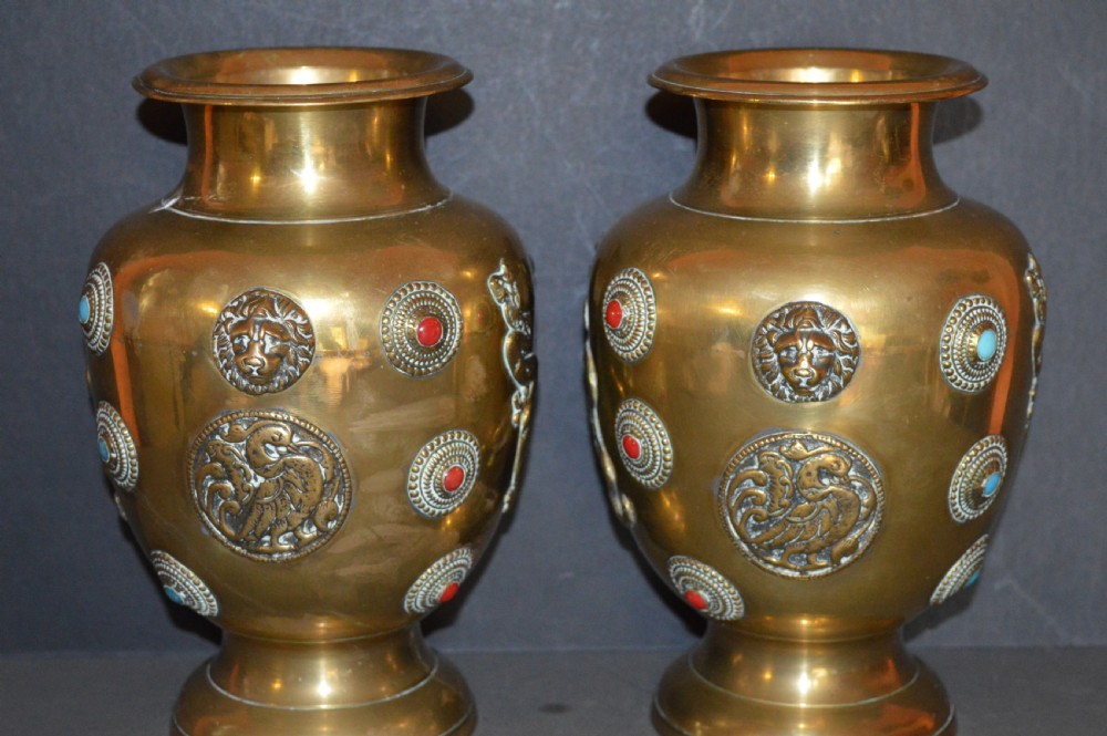 A matching pair of polished brass baluster vases featuring applied serpentine dragon motifs and circular beaded medallions set with turquoise and coral cabochons. View VI