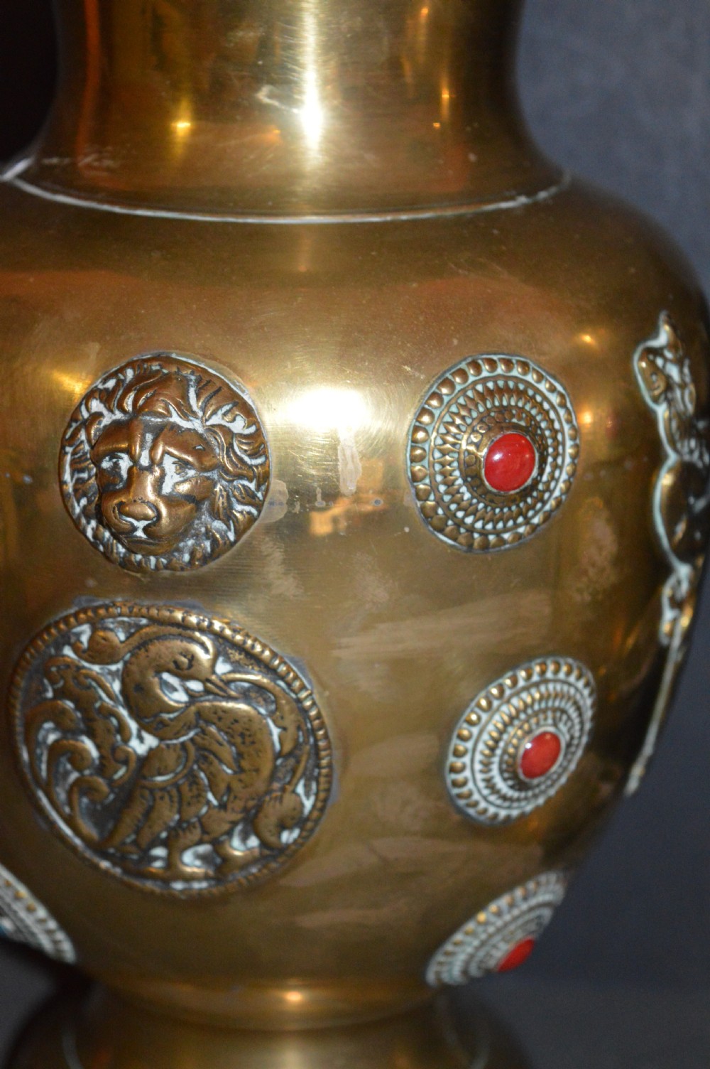 A matching pair of polished brass baluster vases featuring applied serpentine dragon motifs and circular beaded medallions set with turquoise and coral cabochons. View VII
