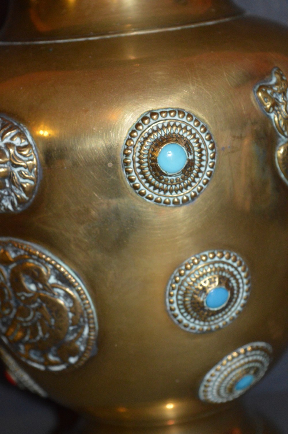 A matching pair of polished brass baluster vases featuring applied serpentine dragon motifs and circular beaded medallions set with turquoise and coral cabochons. View VIII