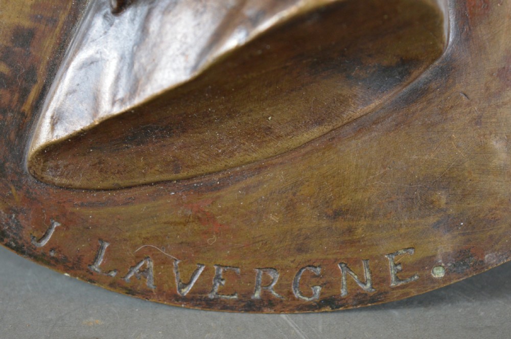 A circular patinated bronze relief plaque displaying a left-facing profile portrait of a man with a moustache, high collar, and bowtie, inscribed F George 1856. View VIII