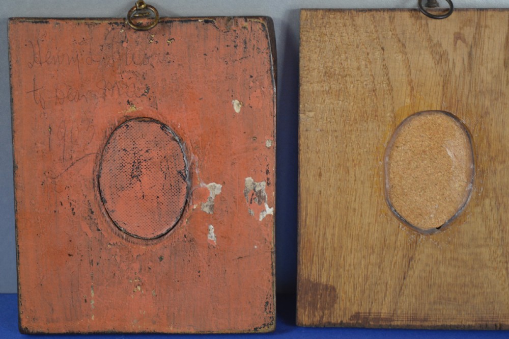 A pair of rectangular wooden plaque frames holding oval hand-painted portrait miniatures of Napoleon and Empress Eugenie within brass bezels. View VII