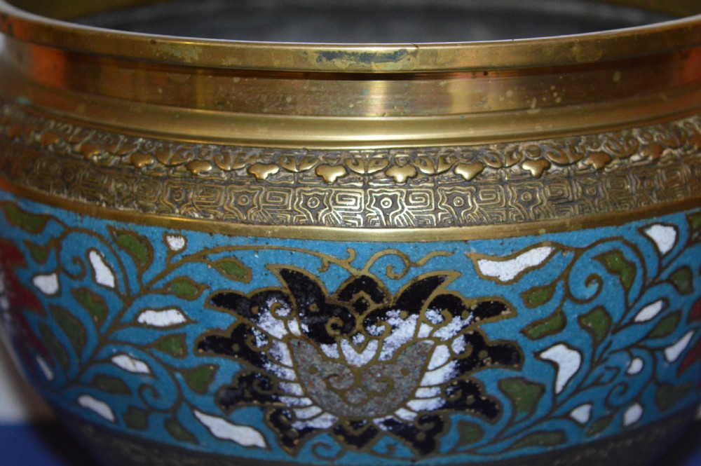 A rounded antique Chinese bronze and cloisonne enamel bowl featuring turquoise ground with floral scroll patterns and a brass rim and base. View III