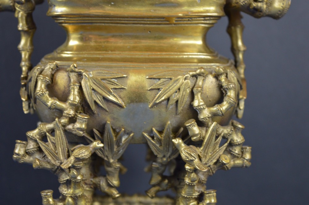 An ornate 19th-century Chinese cast bronze censer featuring bamboo leaf reliefs, sculpted handles, a pierced lid, and an intricate tiered base. View III
