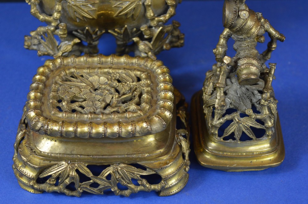 An ornate 19th-century Chinese cast bronze censer featuring bamboo leaf reliefs, sculpted handles, a pierced lid, and an intricate tiered base. View XII