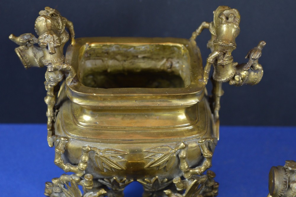 An ornate 19th-century Chinese cast bronze censer featuring bamboo leaf reliefs, sculpted handles, a pierced lid, and an intricate tiered base. View XIII
