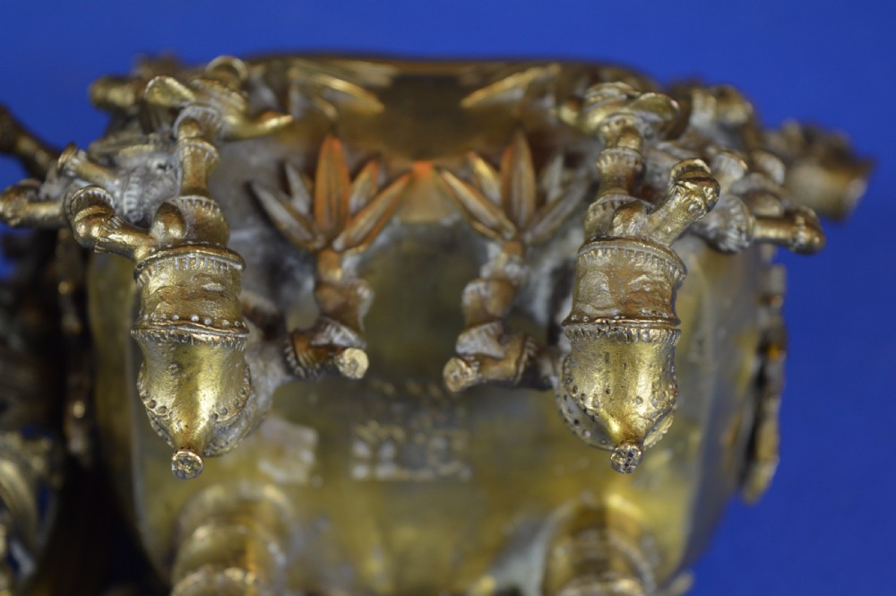 An ornate 19th-century Chinese cast bronze censer featuring bamboo leaf reliefs, sculpted handles, a pierced lid, and an intricate tiered base. View XV