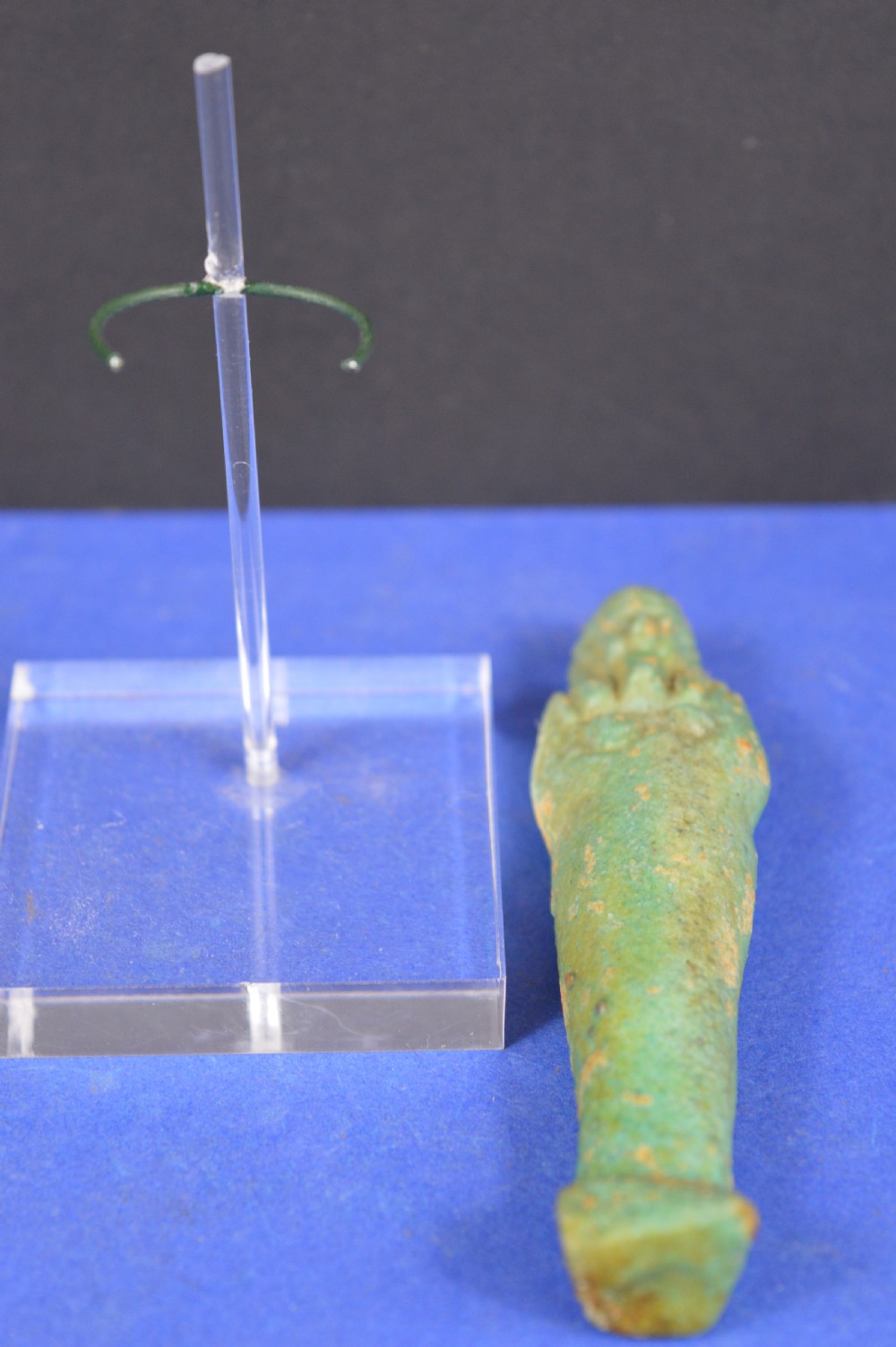A small ancient Egyptian mummiform shabti statuette crafted from light turquoise green glazed faience. View VI
