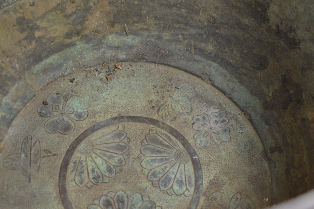 A heavy dark bronze Chinese bowl featuring relief panels with bird and floral motifs, bamboo-style side handles, and a lobed collar over an integral stepped base. View XIV