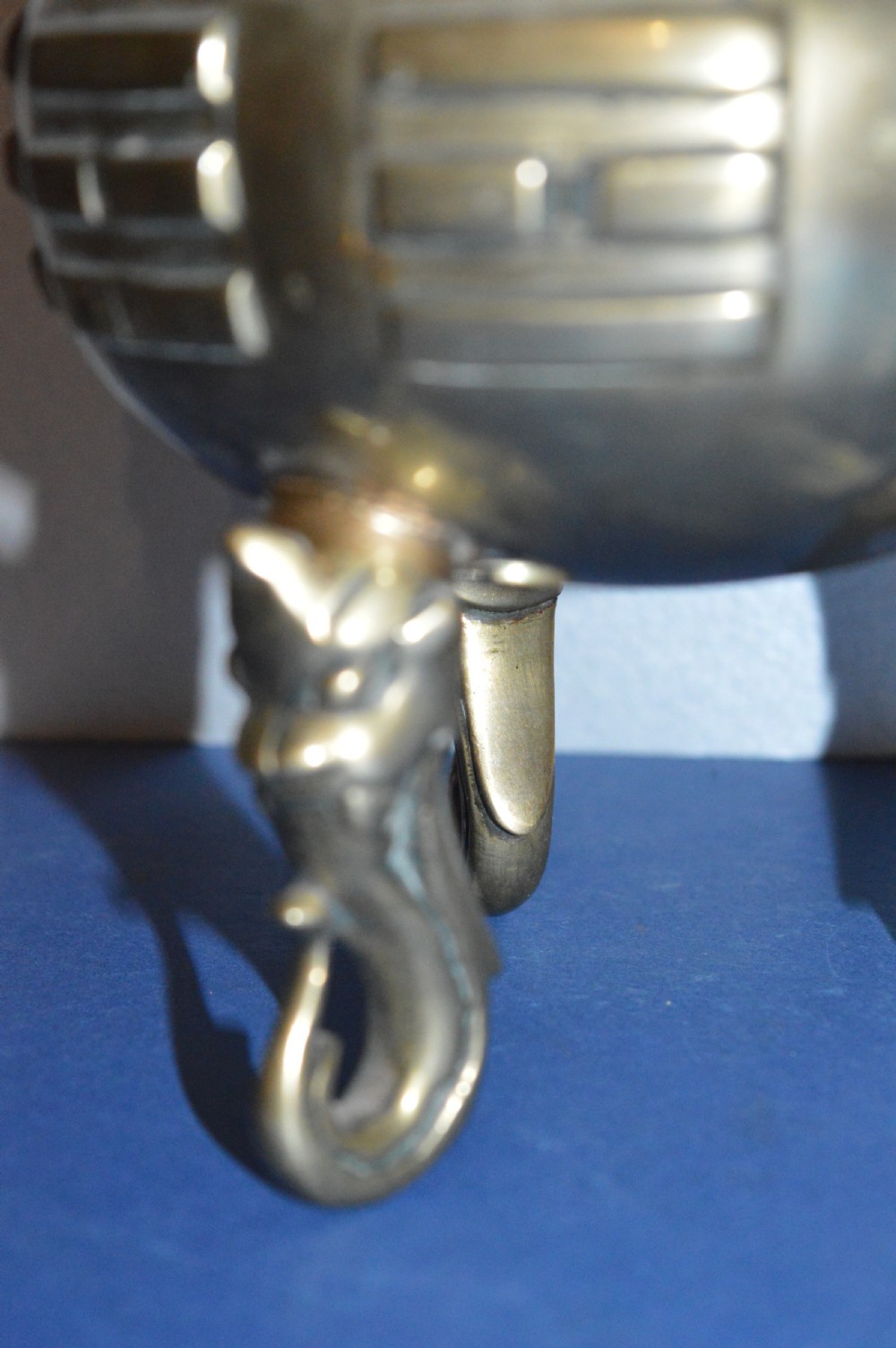 A late nineteenth-century Chinese cast bronze tripod censer featuring raised trigram motifs, upright loop handles, and beast-mask feet. View VI