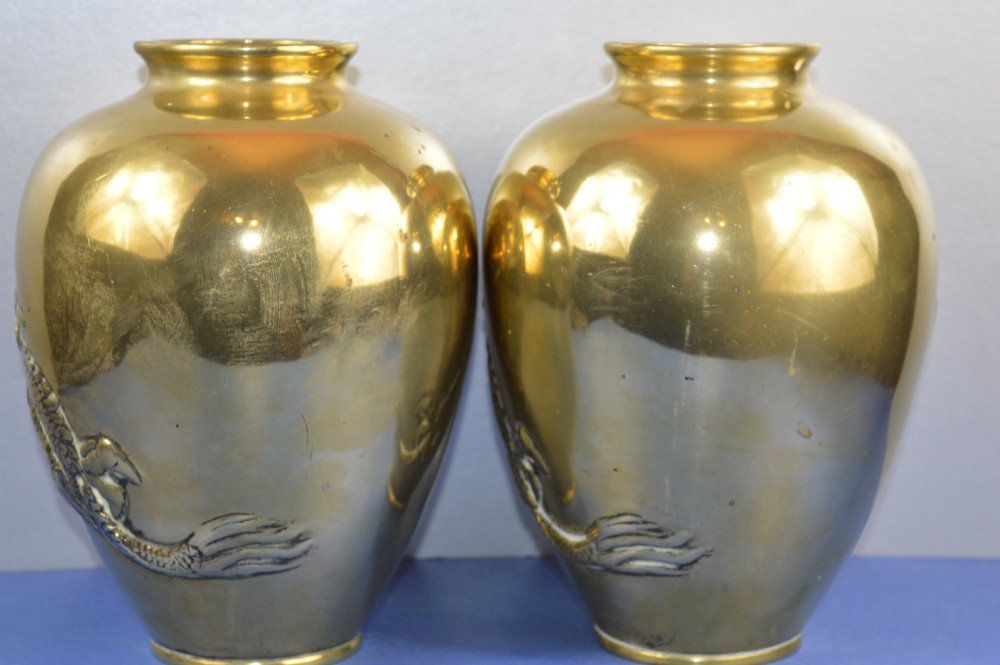A matching pair of heavy polished gold gilt bronze baluster vases featuring carved high-relief dragons amid swirling cloud motifs. View VI