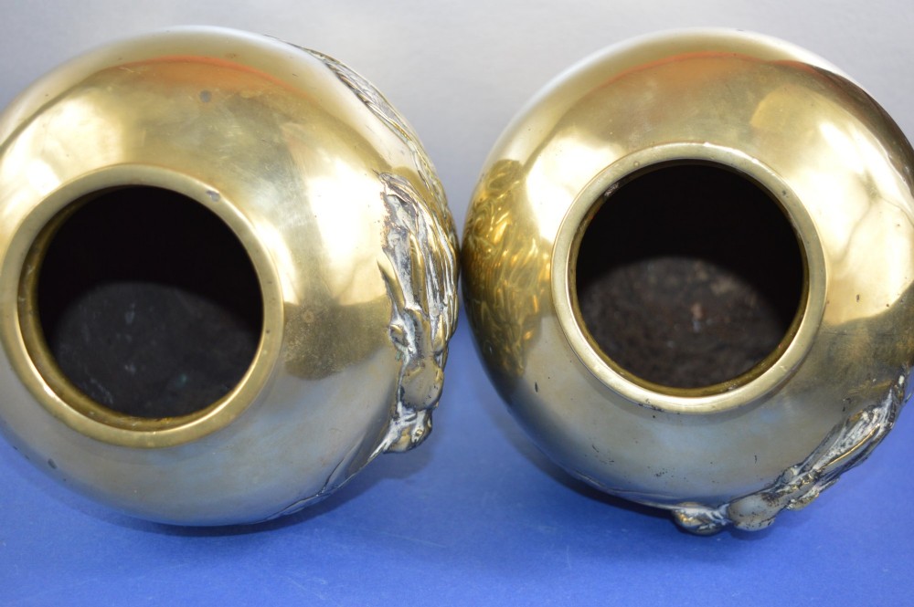 A matching pair of heavy polished gold gilt bronze baluster vases featuring carved high-relief dragons amid swirling cloud motifs. View VII
